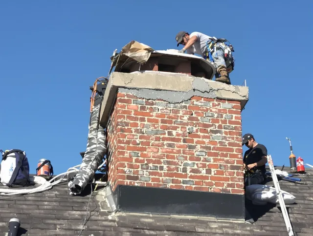 Pinellas Park Chimney Sweep installing a custom chimney crown in Pinellas Park, FL