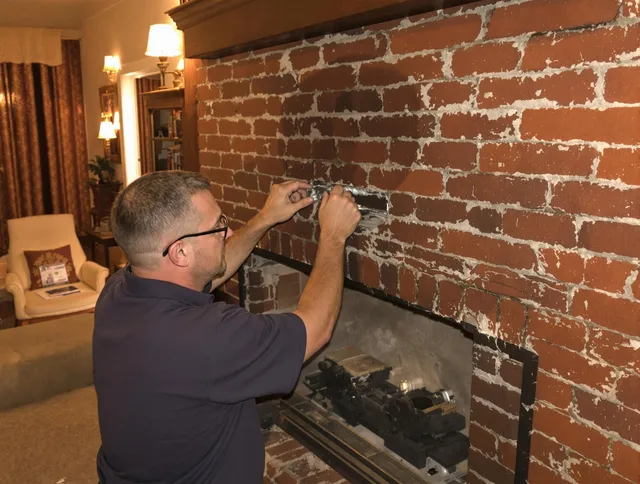 Pinellas Park Chimney Sweep expert fixing a fireplace in Pinellas Park, FL